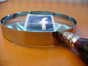 Magnifying glass and Facebook, e-discovery